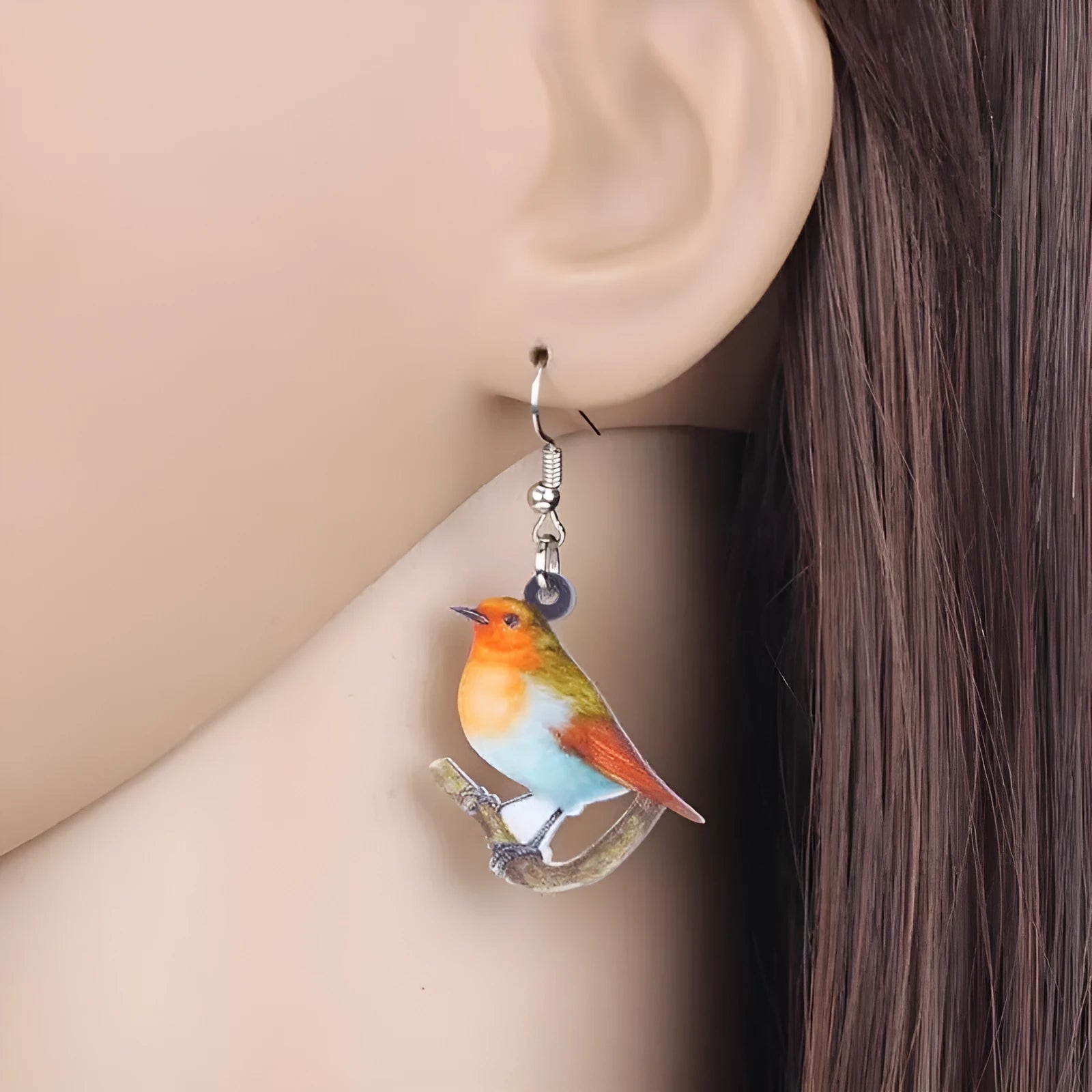 Blue Titmouse acrylic pendant earrings with geometric animal zodiac design and snake elements