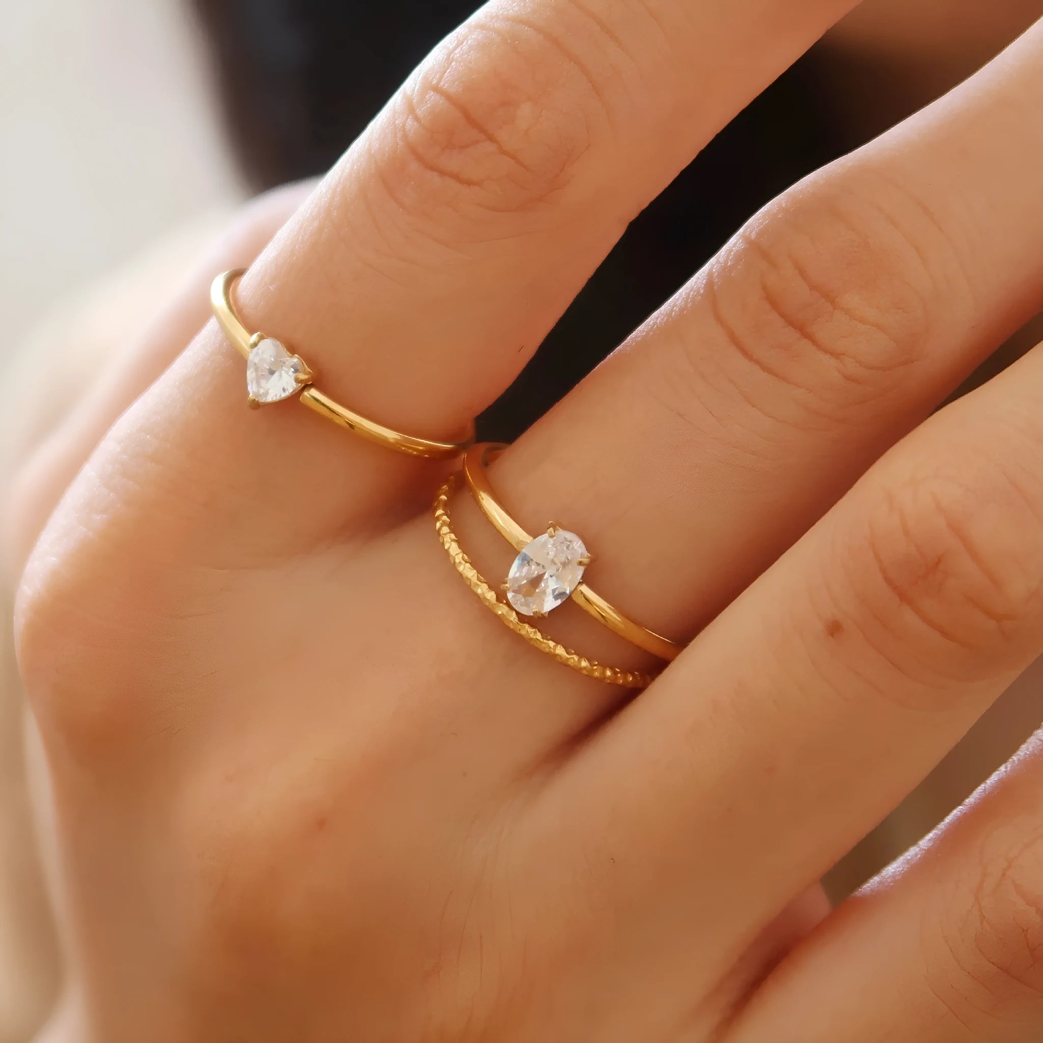 Golden electroplated stainless steel ring in heart or oval shape available in sizes 5 to 8