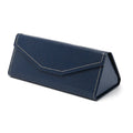 Handmade black PU cowhide triangular folding glasses case open next to a pair of spectacles.