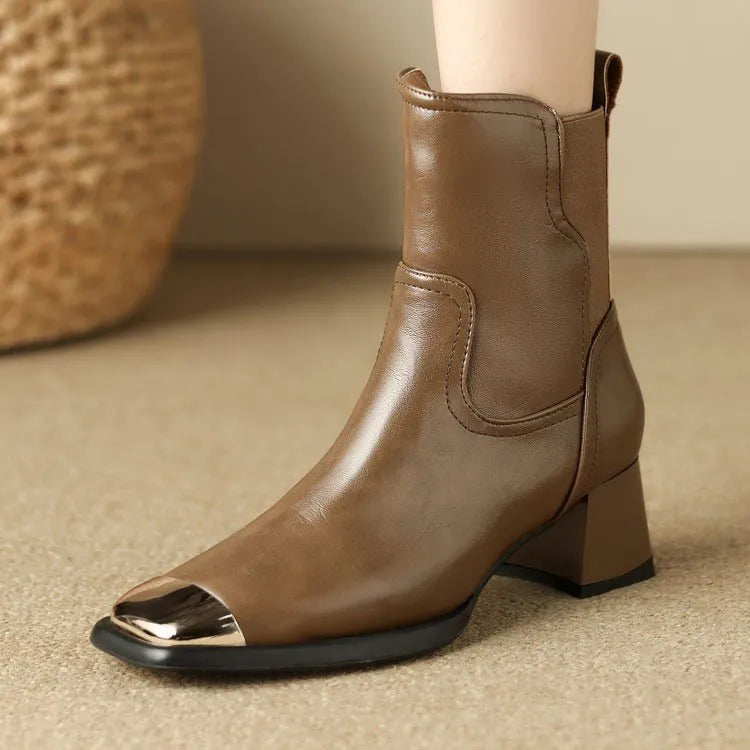 Brown high-heel Martin boots made of cowhide leather with a side zipper closure.