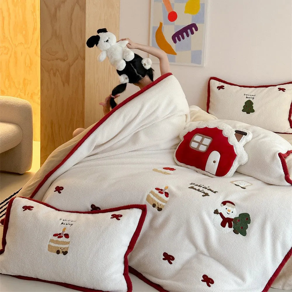Winter Christmas cartoon pattern four-piece polyester bedding set showing heart design on duvet cover and pillowcases.