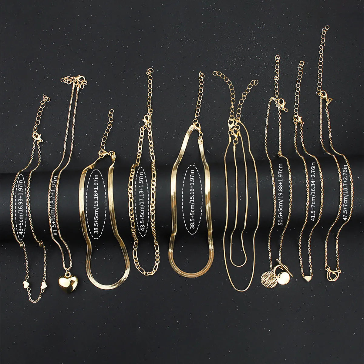 Women's gold electroplated 10-piece necklace set with snake bone chain and adjustable length