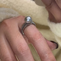 Women's adjustable open ring with geometric design and black pearl finish on copper.