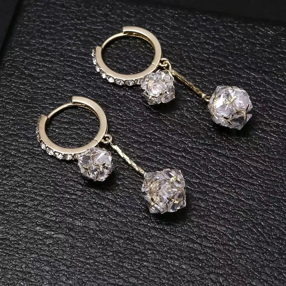 Women's silver-toned drop earrings with a double pendant and rhinestone ball tassel on an ear clip.