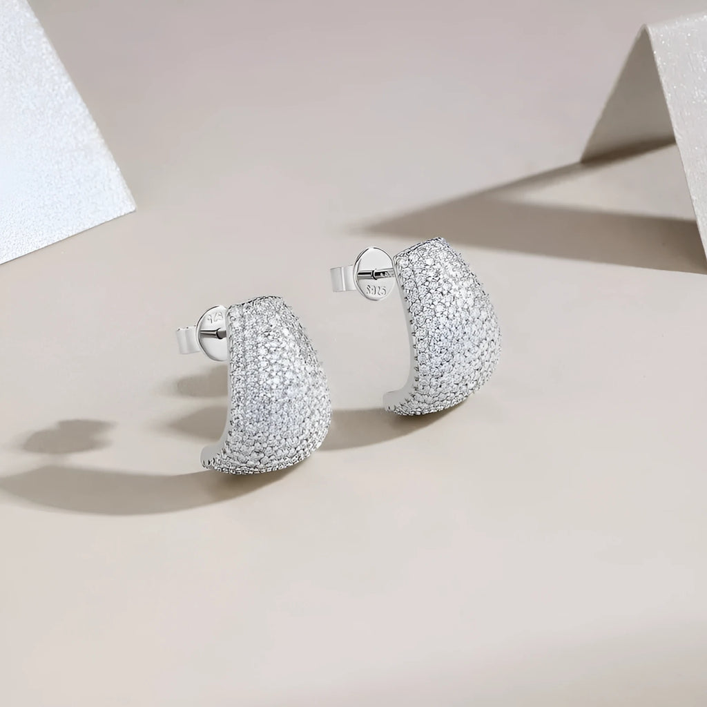 Geometric shaped sterling silver stud earrings with a white moissanite stone.