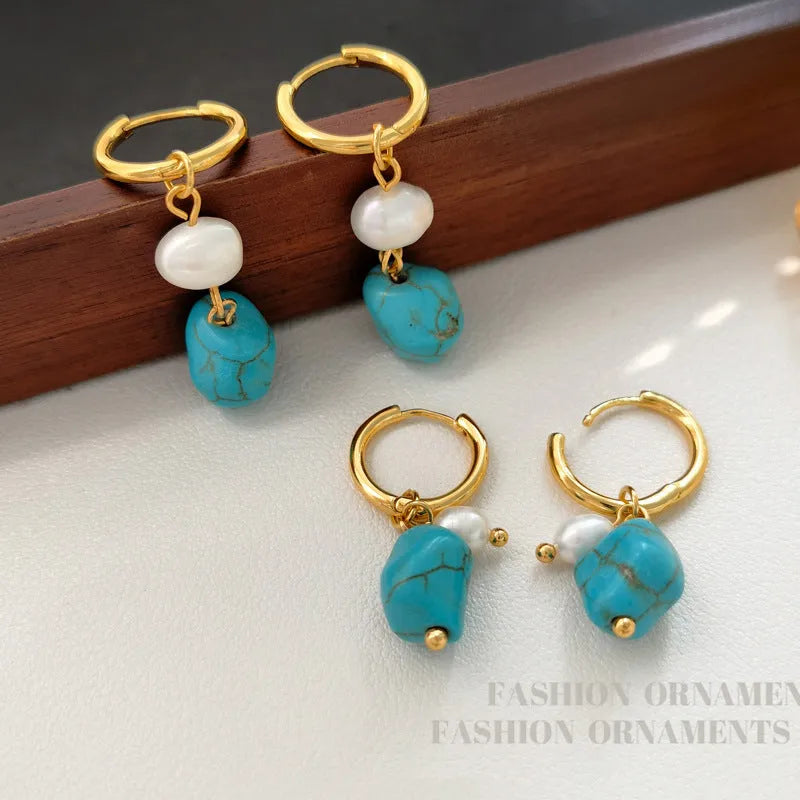 Geometric irregular shaped copper clip-on earrings with turquoise stones and cultured pearls.