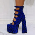Women's black patent leather waterproof platform high heel boots with a thick heel and serpentine ankle strap.