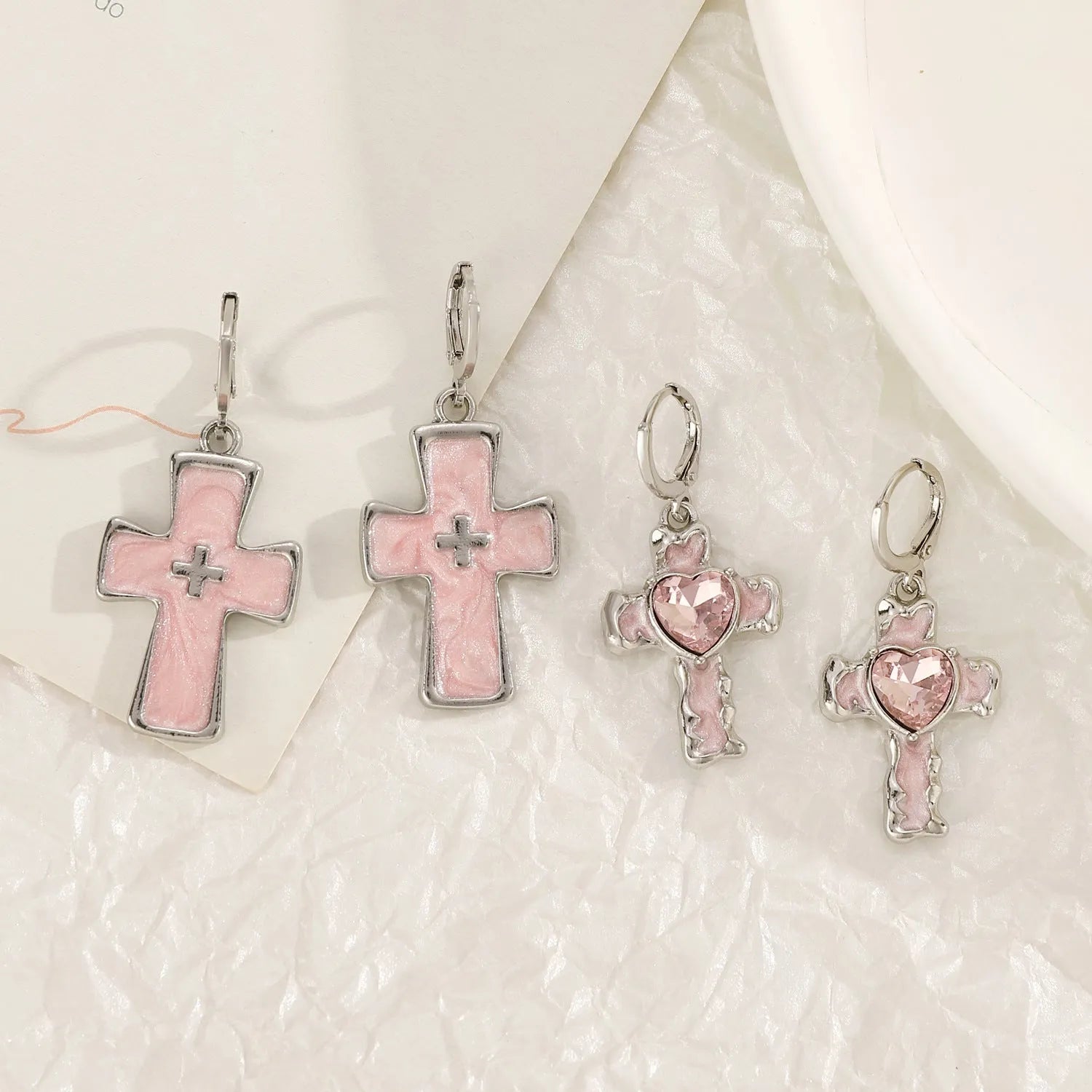 Women's cross crystal earrings in five colour variations with alloy construction and geometric design