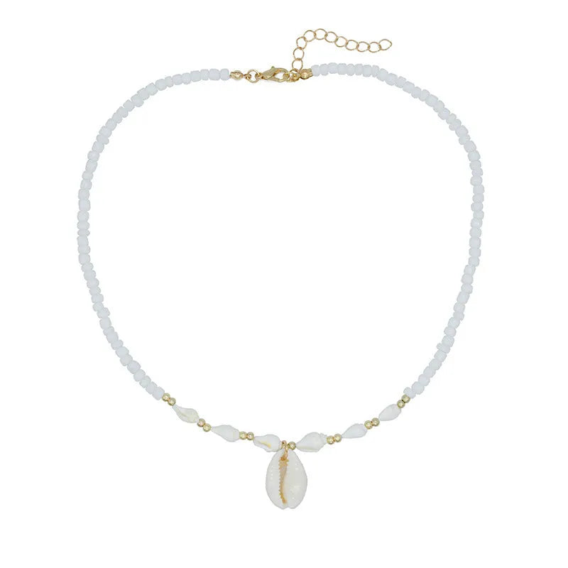 White necklace with a conch shell pendant made from Mother Pearl shellfish on an electroplated chain.