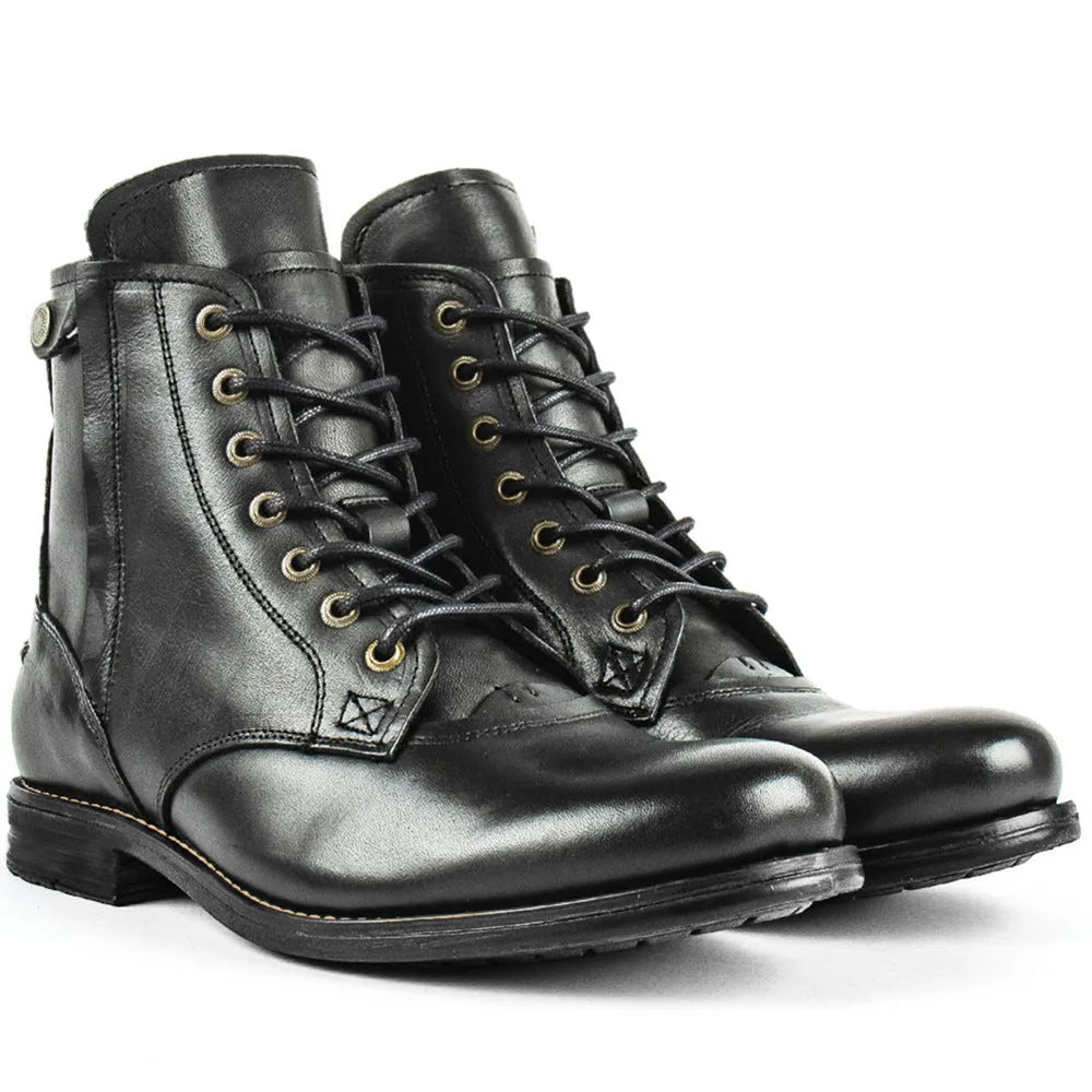 Black and brown two-tone leather ankle boots with side zipper and low heel.
