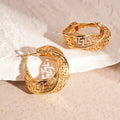 Women's geometric hollow stud earrings with twisted round design in gold or silver finish