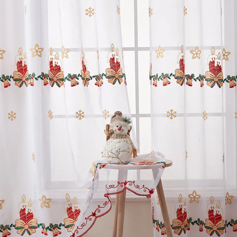 Pair of red and white Christmas curtains with embroidered snowflake design, showing light filtering through.