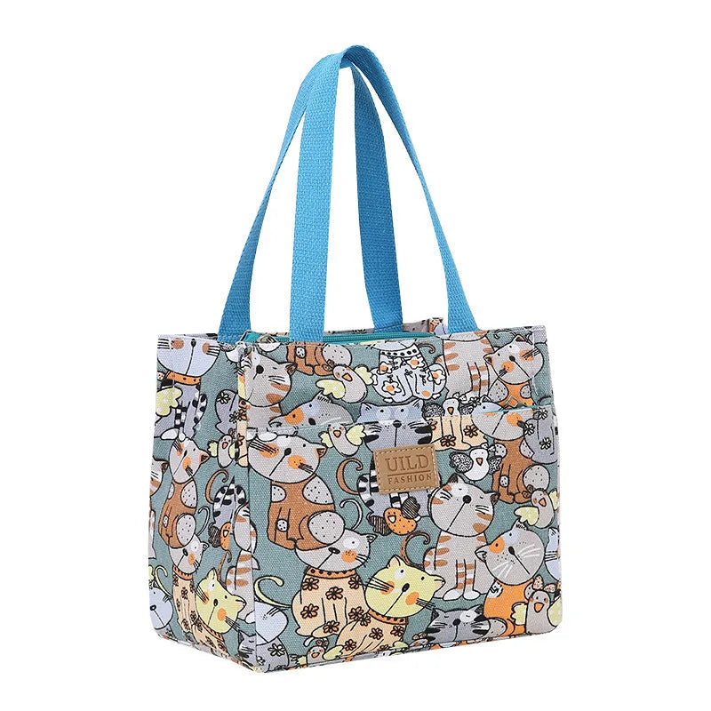 Women's portable square canvas bag with aluminium handle in a choice of printed designs including flowers and cats.