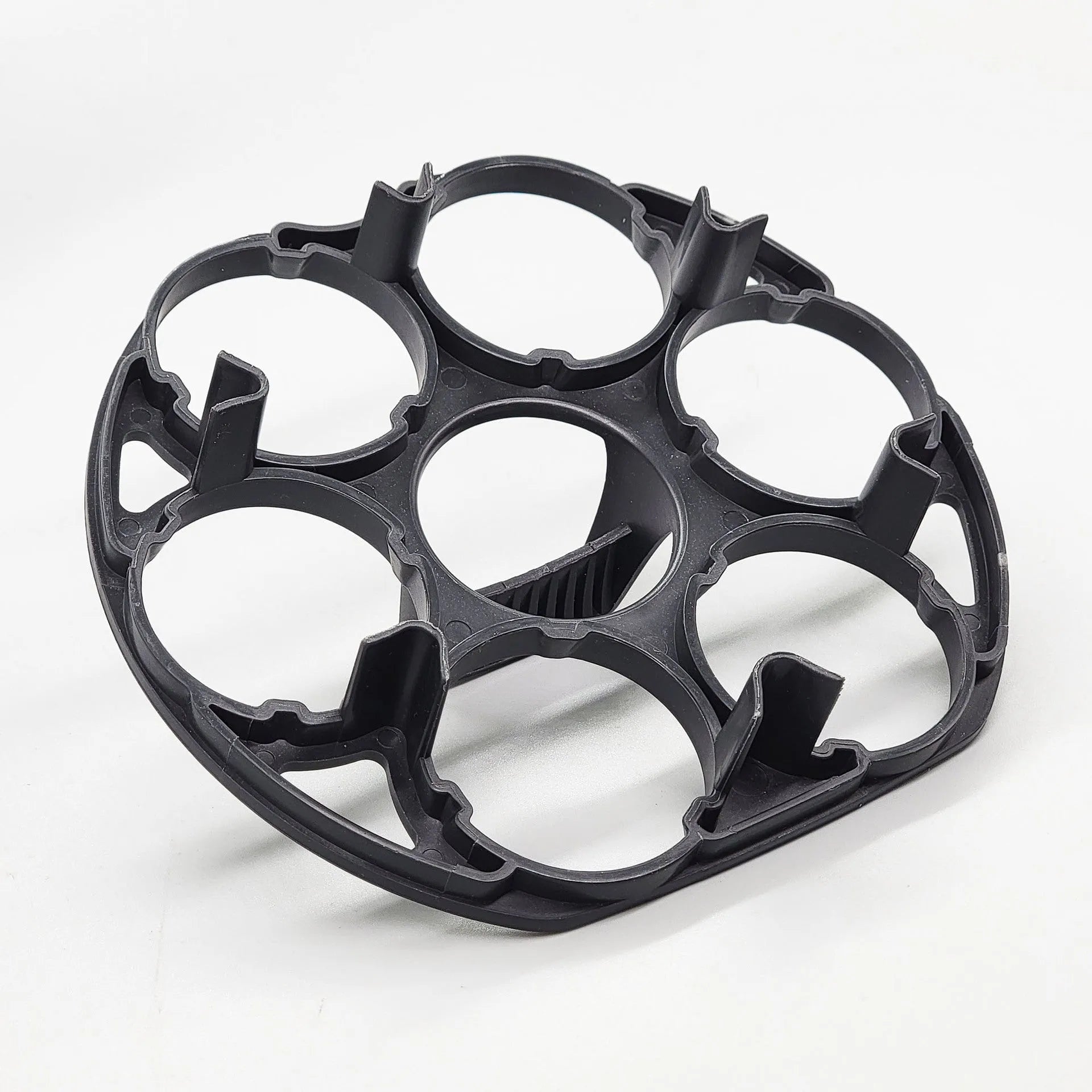 Black plastic egg holder with retainer design for kitchen storage, measuring 13.8cm by 12.6cm