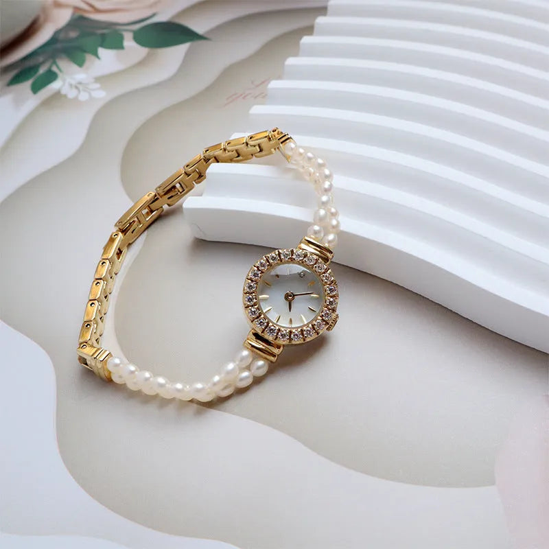 Women's light gold bracelet watch with freshwater pearls, round 18mm dial, stainless steel strap