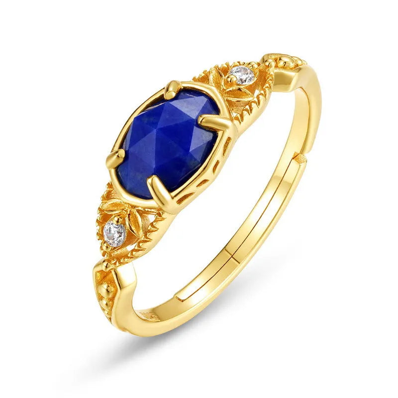 Japanese style silver alloy ring with blue elliptical lapis lazuli stone and geometric design.