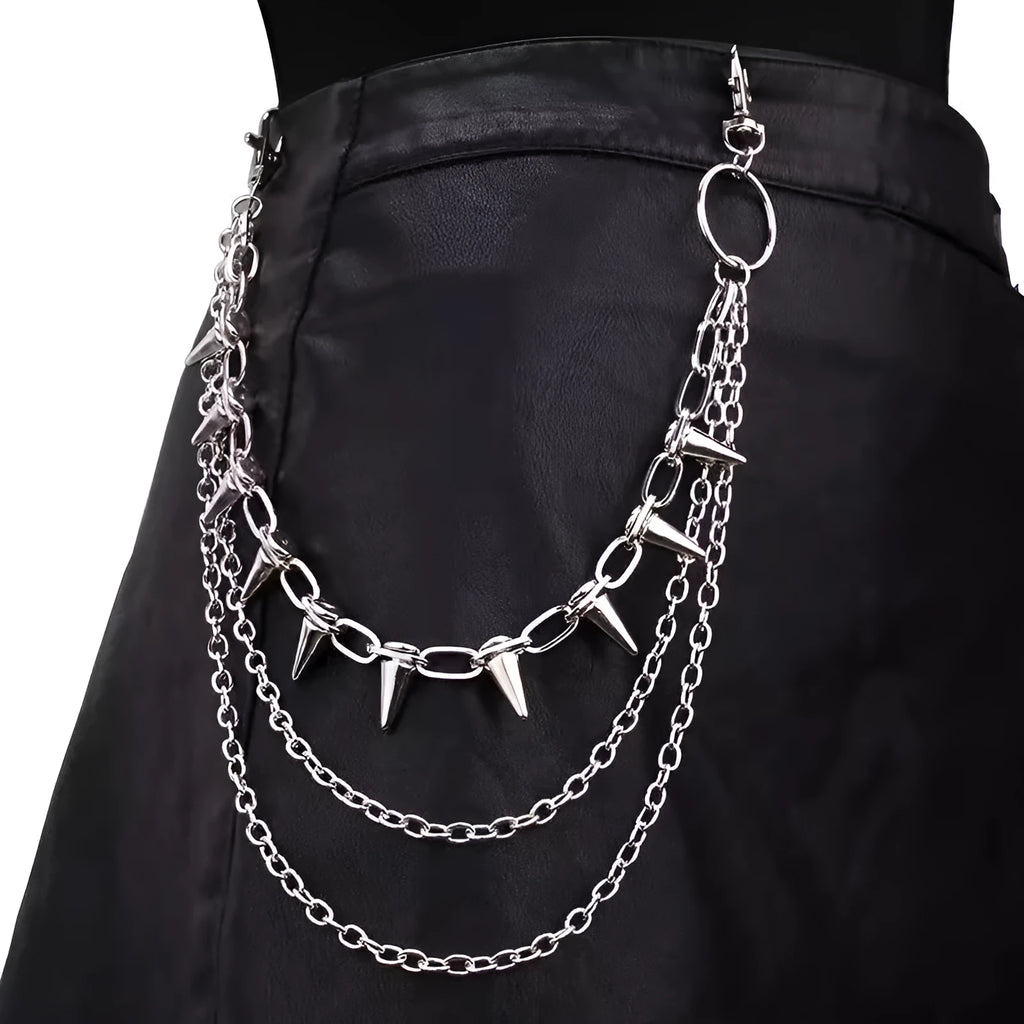 Silver punk pants chain with double layers, zipper detail, and rivet accents against dark background
