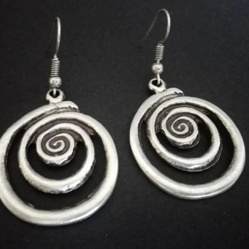 Retro geometric spiral earrings with distressed silver finish measuring 2.6 by 5 centimetres
