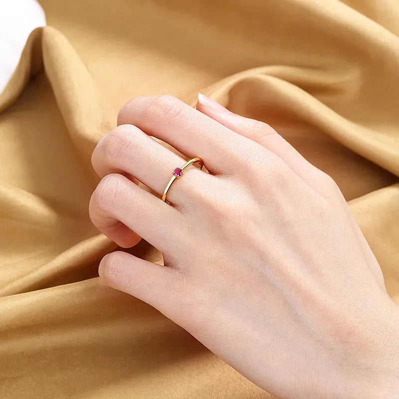 Women's personalised copper ring with a single diamond, shown in white, red, green, and blue colour options.
