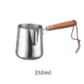 Stainless steel coffee cup with measurement scale markings and wooden handle shown in solid colour