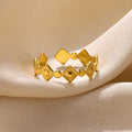 Geometric gold diamond titanium steel women's ring showing adjustable free-size band design
