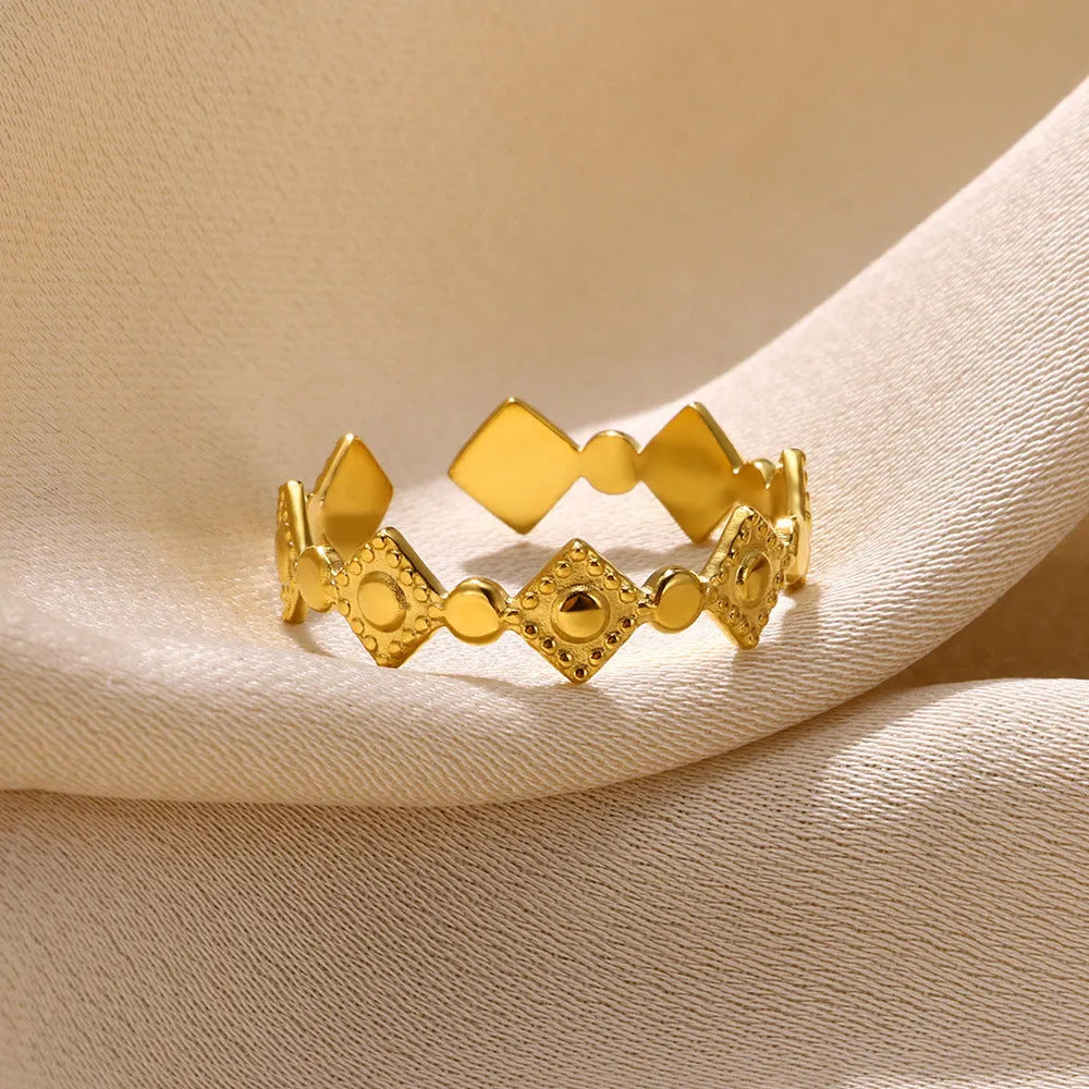 Geometric gold diamond titanium steel women's ring showing adjustable free-size band design