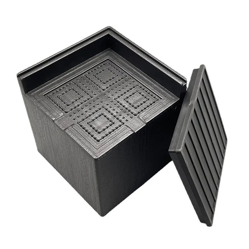 Black plastic bed foot mat set for furniture height increase in four piece pack