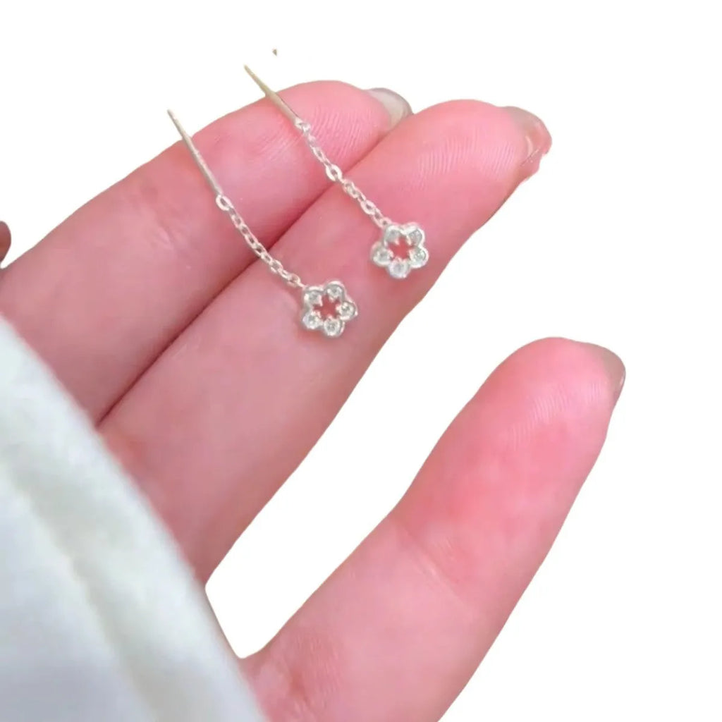 Silver colour hollow flower stud earrings with petal design on alloy posts
