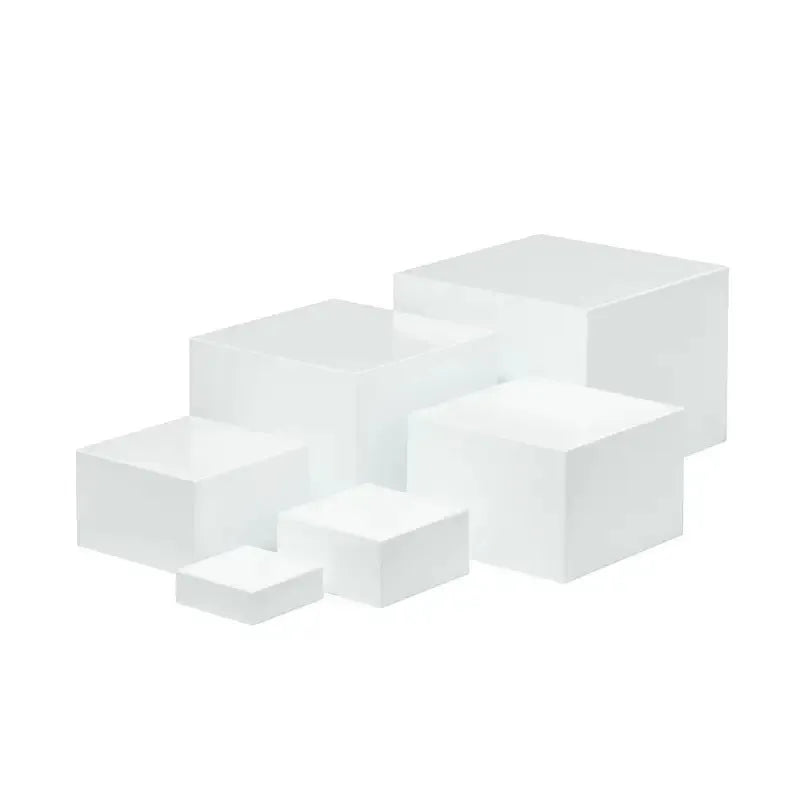 White plastic cube dessert display stand with six modular stacking components for cake presentation