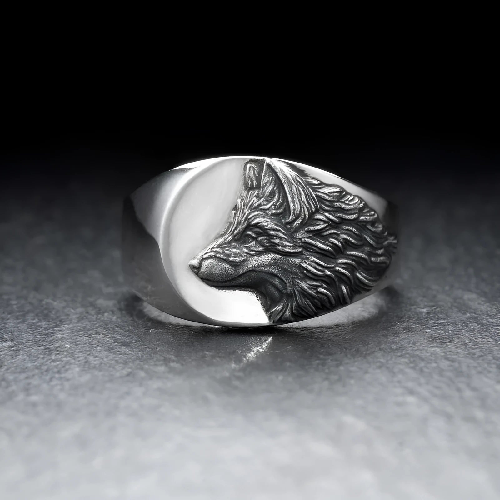 Silver geometric wolf head men's ring shown from multiple angles on a hand