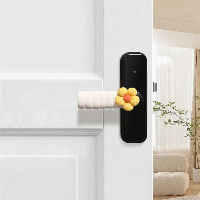 Flower pattern soft PEVA door handle protective cover on a round door knob.