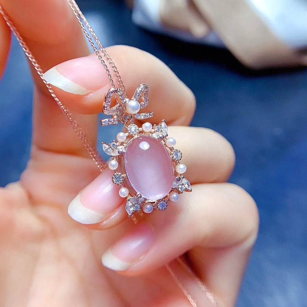 Geometric rose quartz pendant on a silver chain with rose gold plating