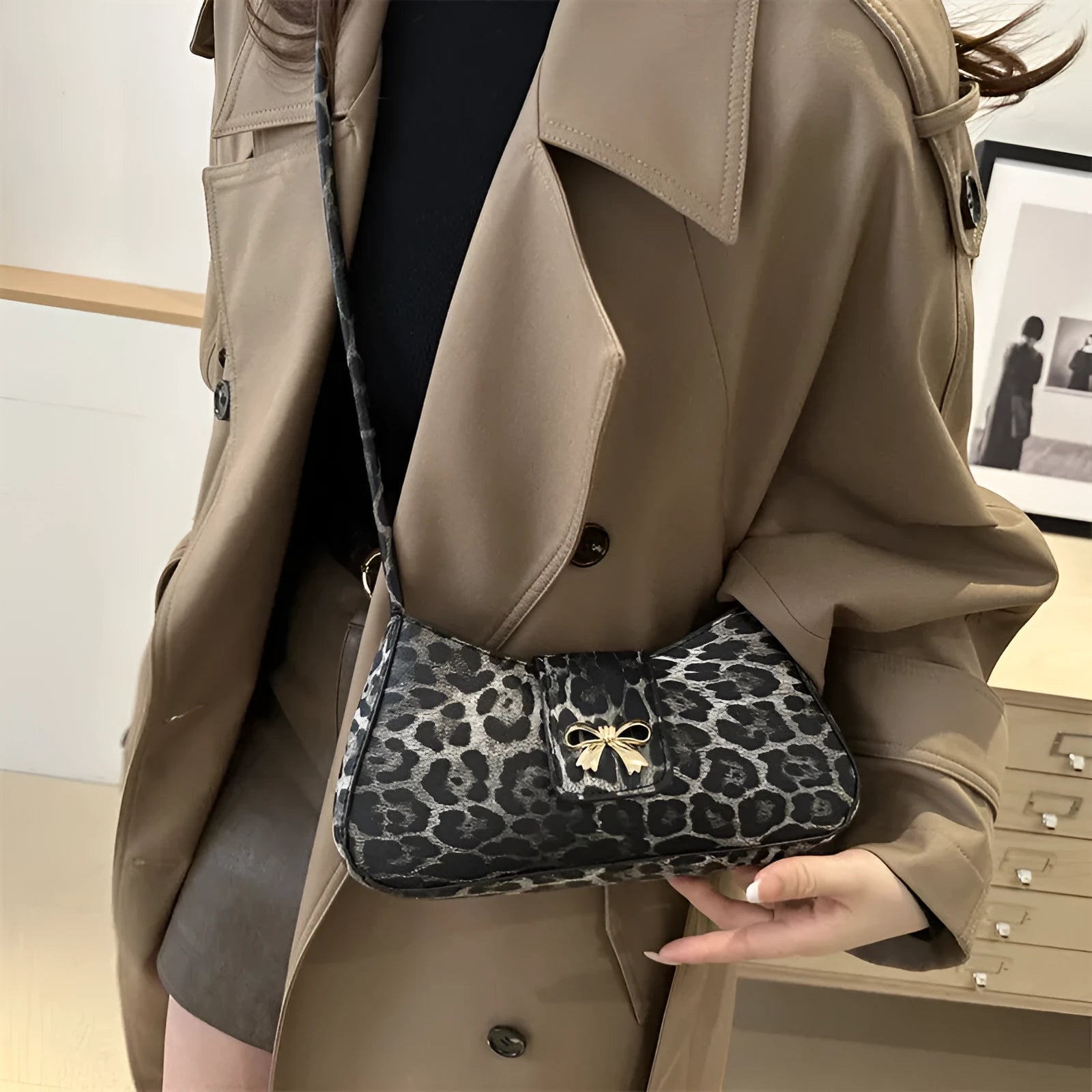 Casual women's PU handbag with sandwich pocket organisation in black colour showing 27 cm width