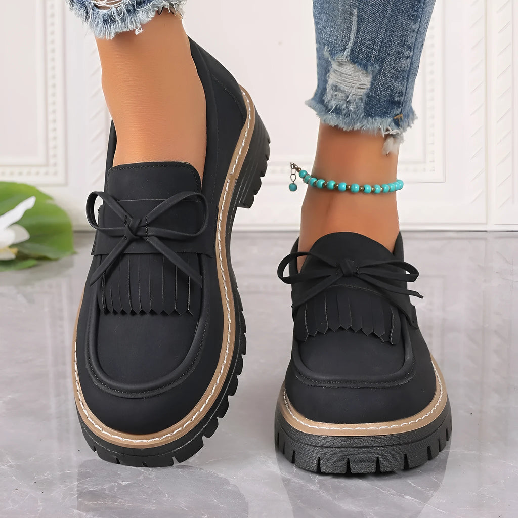 Women's black plus size loafers with tassel decoration, chunky heel, and round toe design