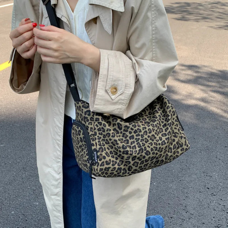 Leopard print sports style cross-body messenger bag with large capacity and durable stitching