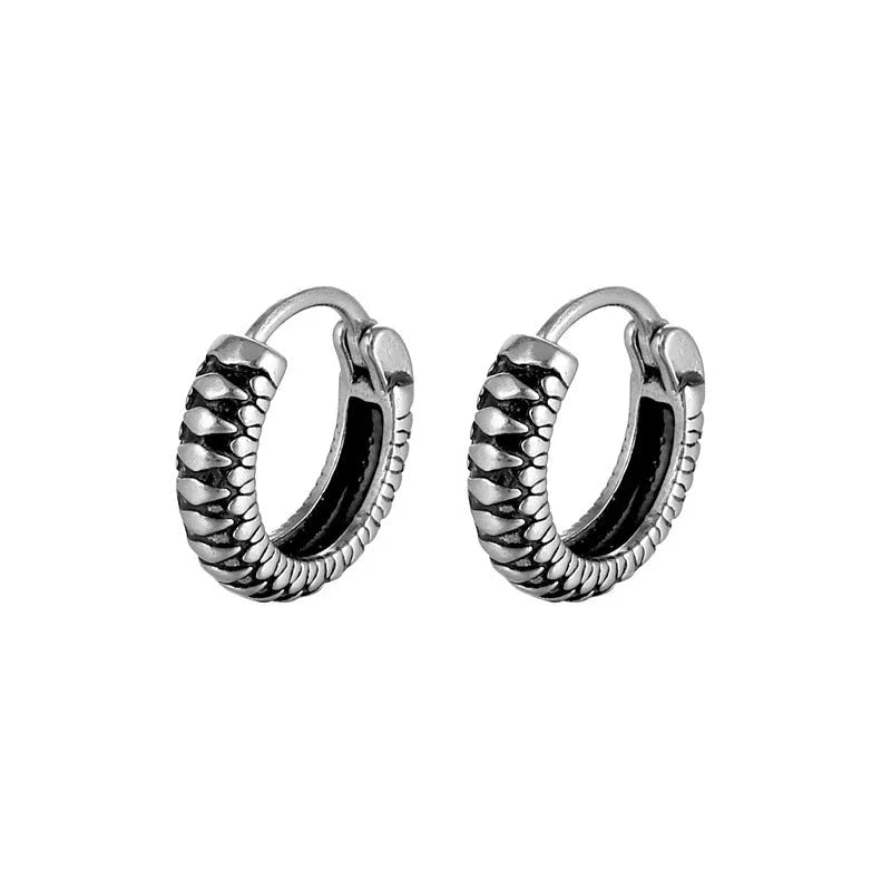 Silver geometric earrings with a retro twist striped pattern, made from titanium steel.