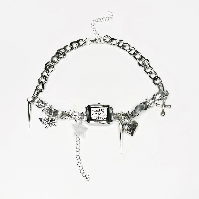 Dark multi-layer cross necklace with twin clavicle chains on model