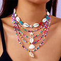 Five-piece women's necklace set with shell beads and adjustable chains in blue and coloured variations