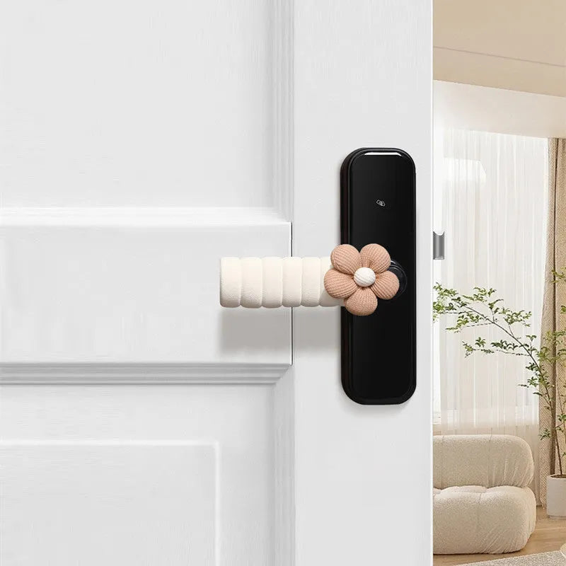 Flower pattern soft PEVA door handle protective cover on a round door knob.
