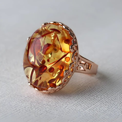 Amber ring with beeswax-coloured genuine amber stone in retro ethnic alloy setting