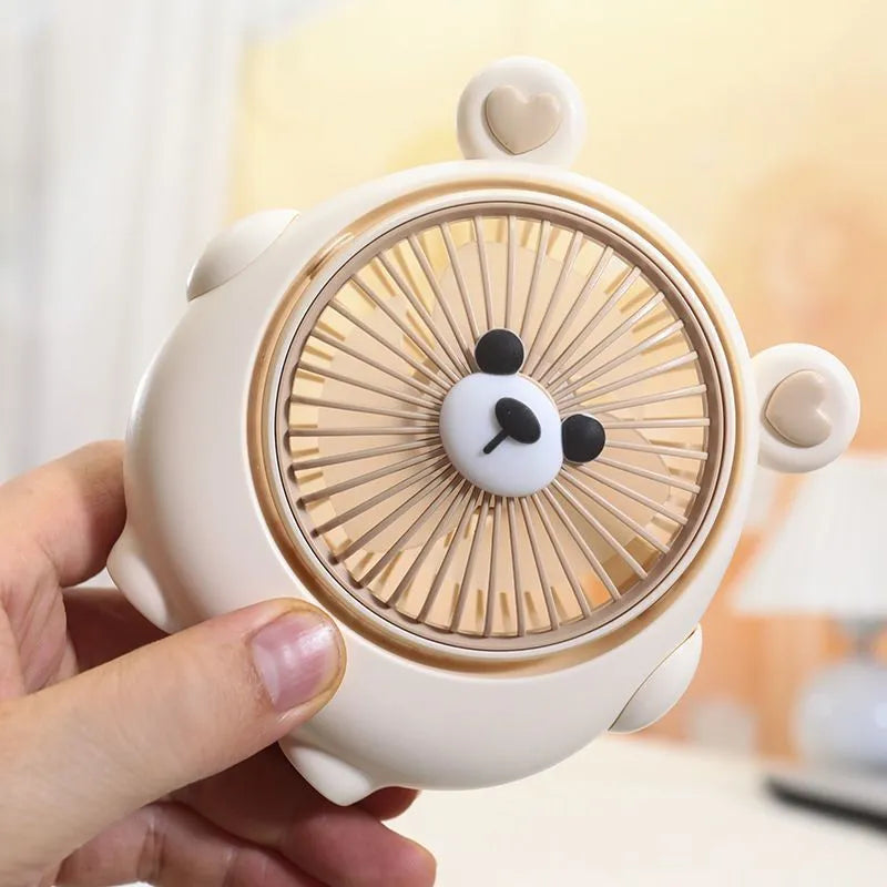 Cute dog shaped USB powered desk fan with three speed settings on a wooden table.