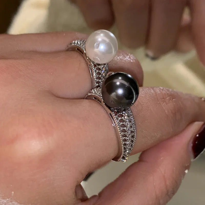 Women's adjustable open ring with geometric design and black pearl finish on copper.
