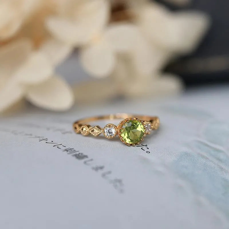 Japanese style geometric copper ring with quadrilateral design and imitation peridot colouration