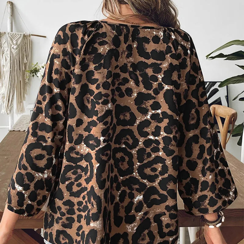 Women's leopard print V-neck pullover top with half sleeves and pleating details