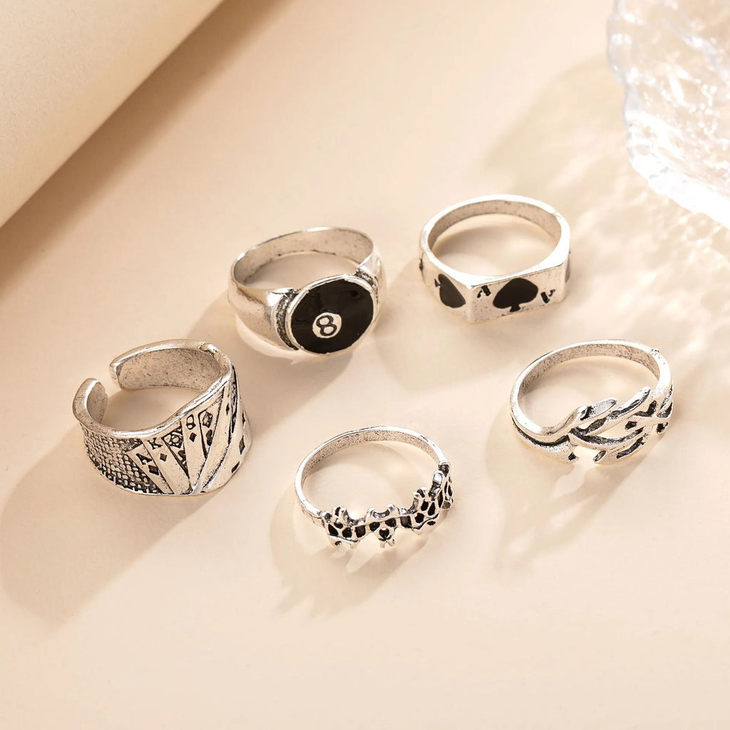 A black alloy ring for women featuring a raised retro poker card spade design.