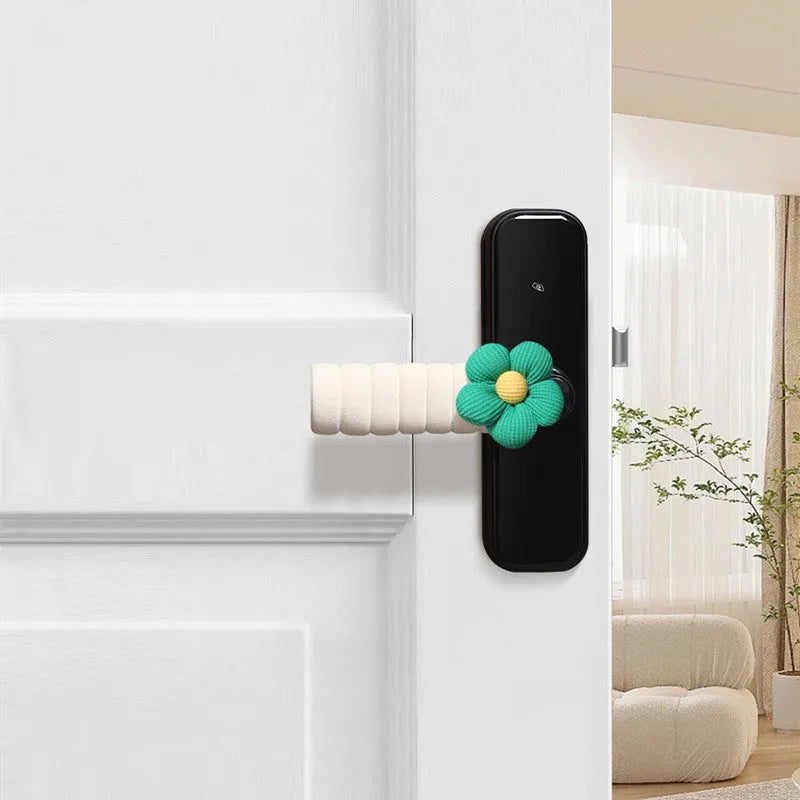Flower pattern soft PEVA door handle protective cover on a round door knob.