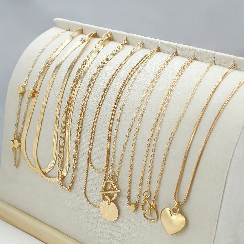 Women's gold electroplated 10-piece necklace set with snake bone chain and adjustable length