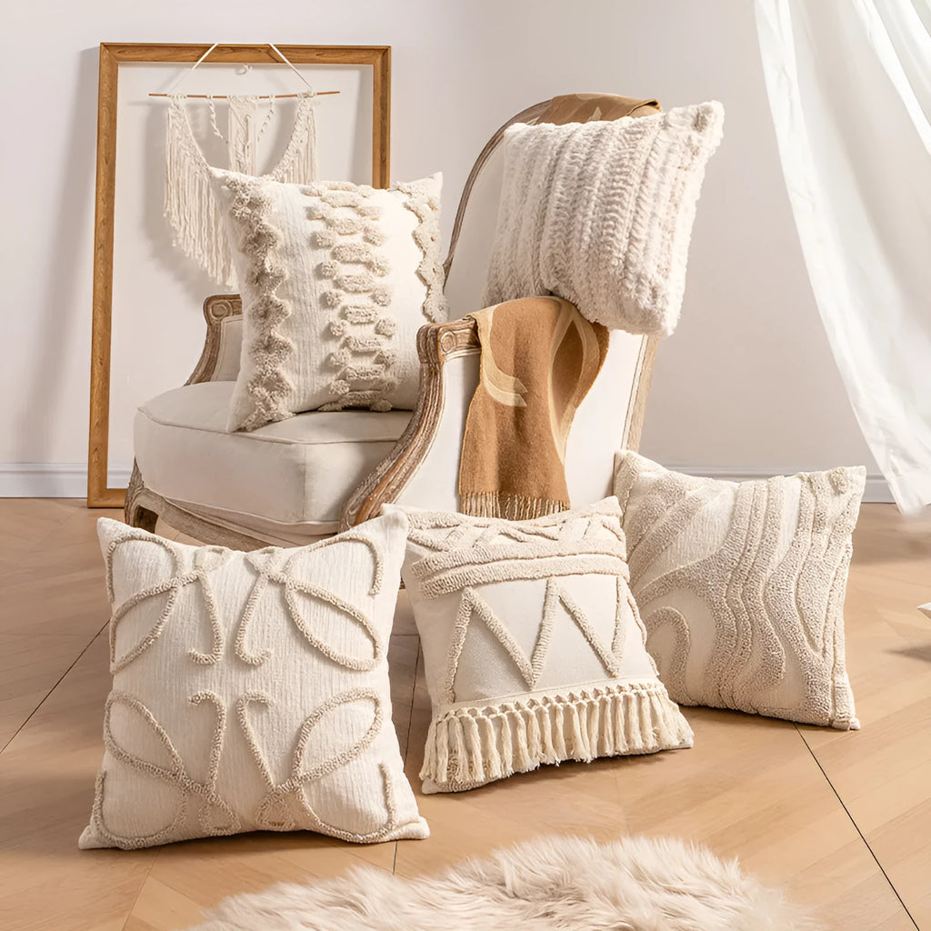Knitted striped cushion cover with tassel detail in spiral dots design, shown in 45x45cm size.