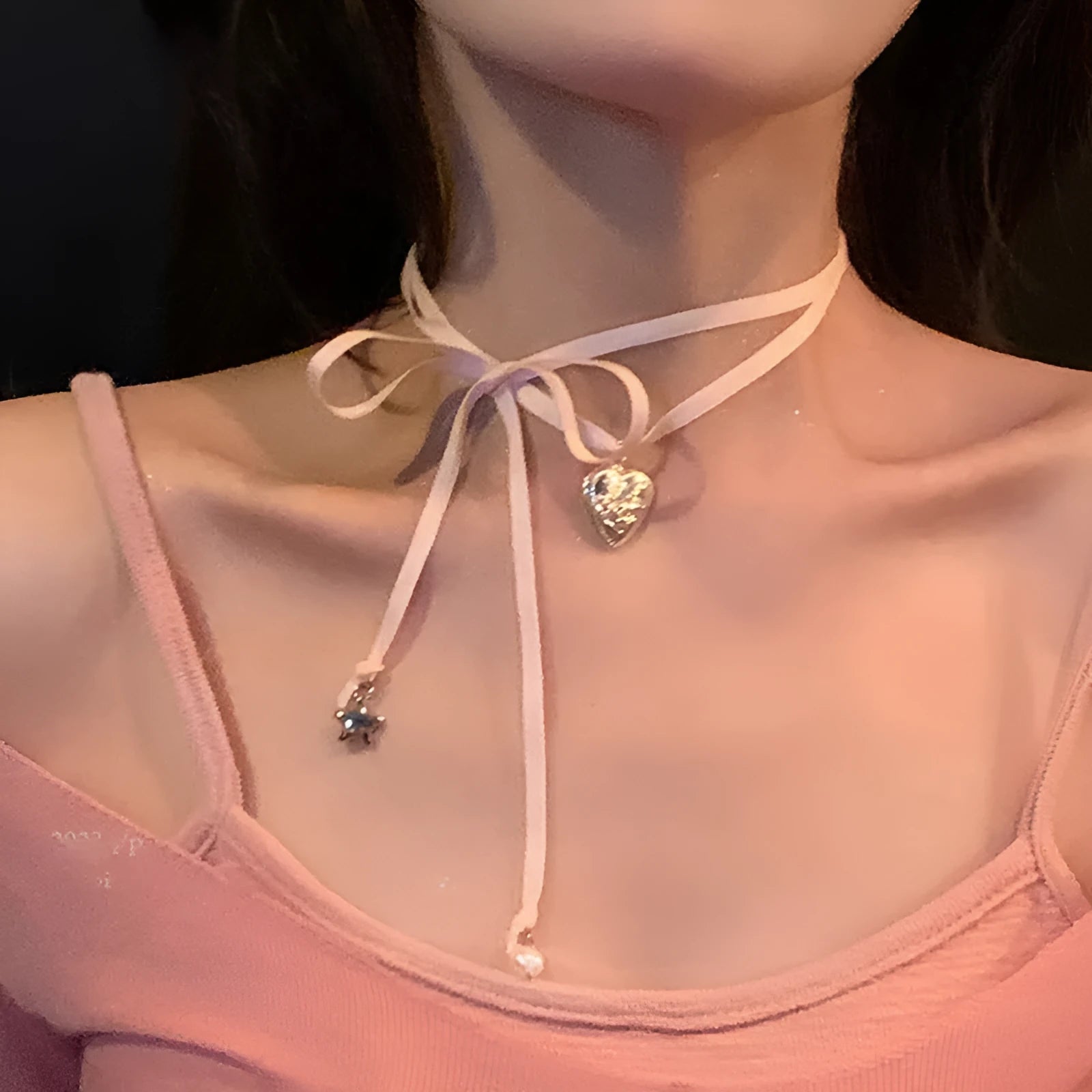 Women's alloy ribbon love pendant necklace on a clavicle chain, shown in one of 33 available colours.