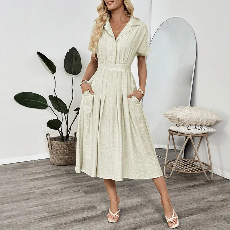 Light green lapel shirt dress with waist-tight skirt and pocket for office wear.